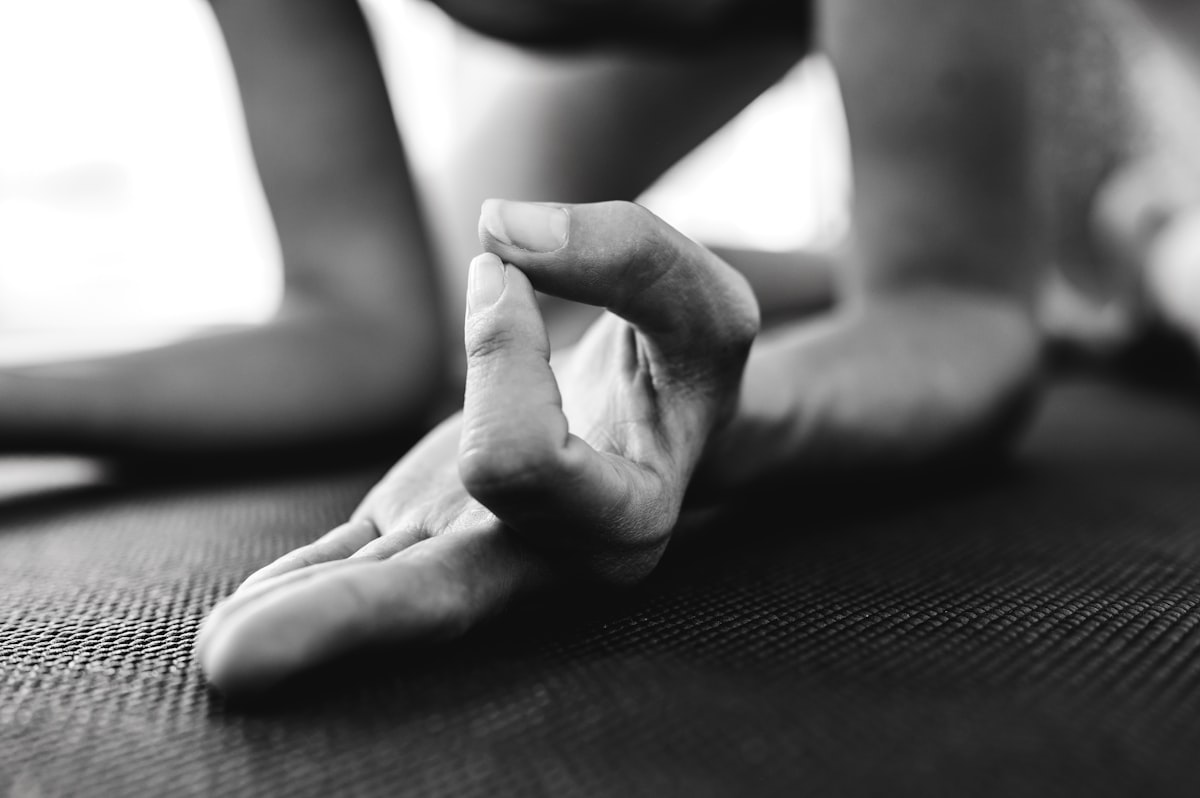 Serene yoga practitioner in meditation pose with natural light